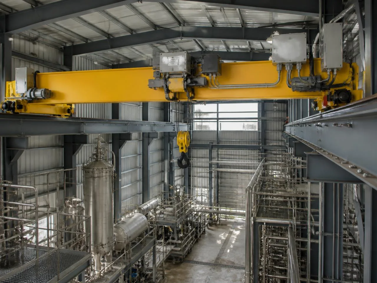 Close-up of an explosion-proof crane motor and control enclosure with Class I Div 2 Groups C and D nameplate